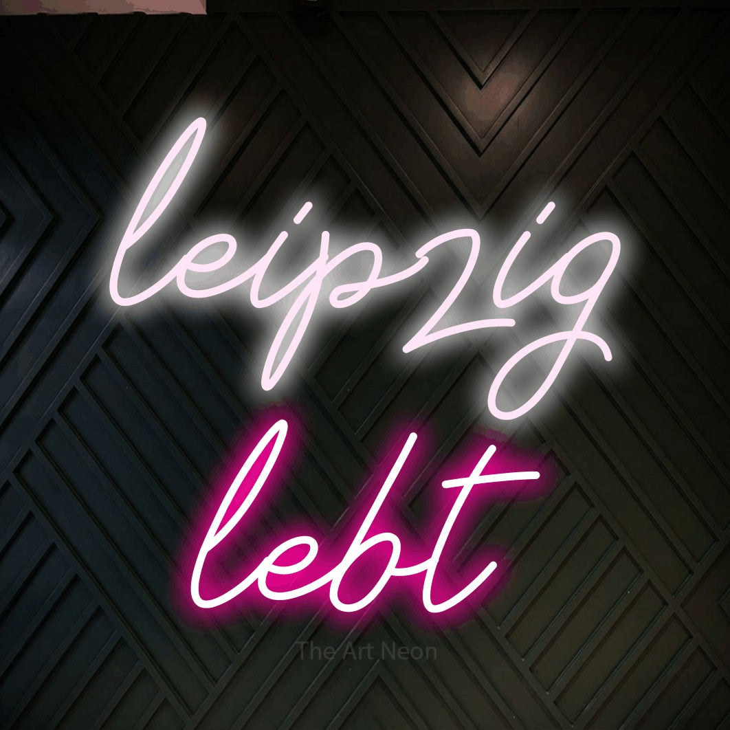 LED neon sign reading “leipzig lebt”, arranged in 2 lines.