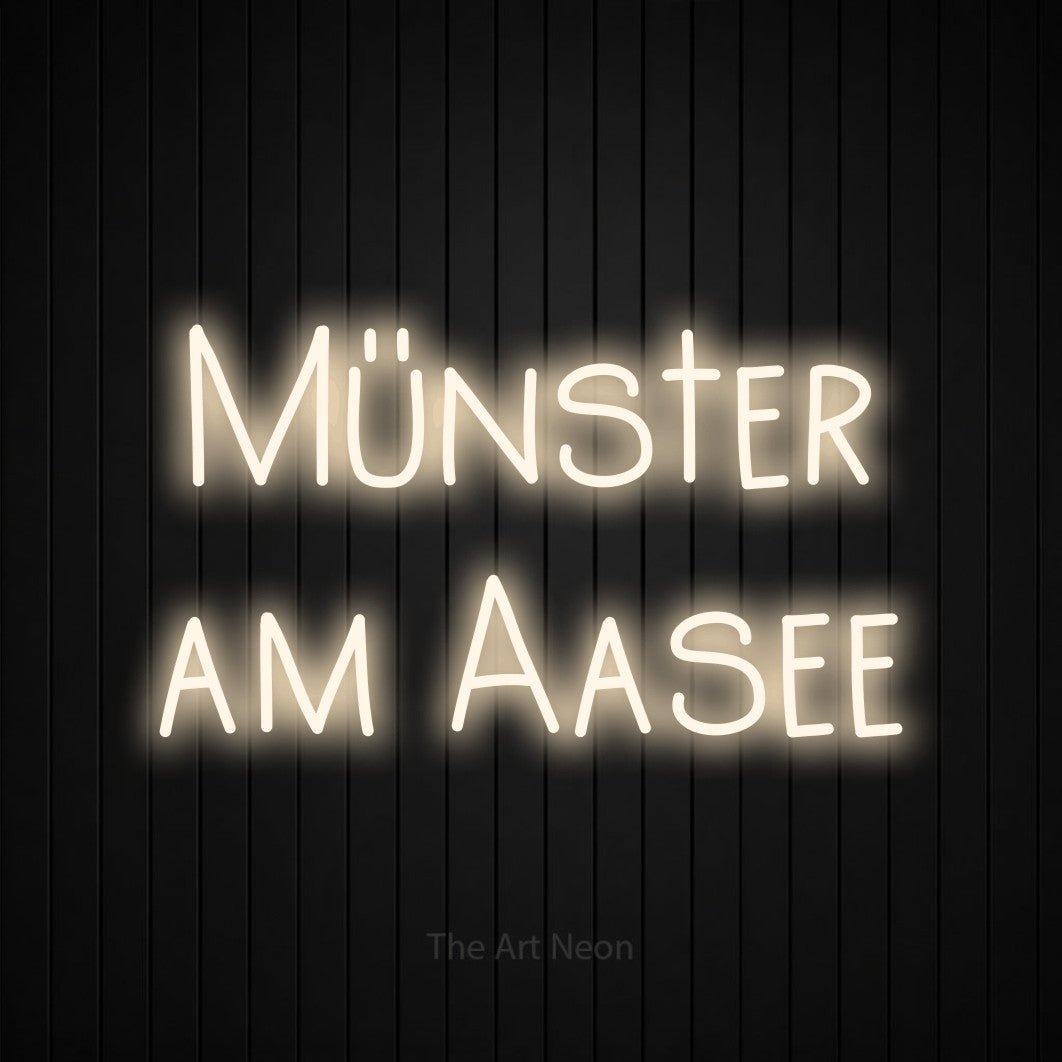 LED neon sign reading “Münster am Aasee”, arranged in 2 lines.
