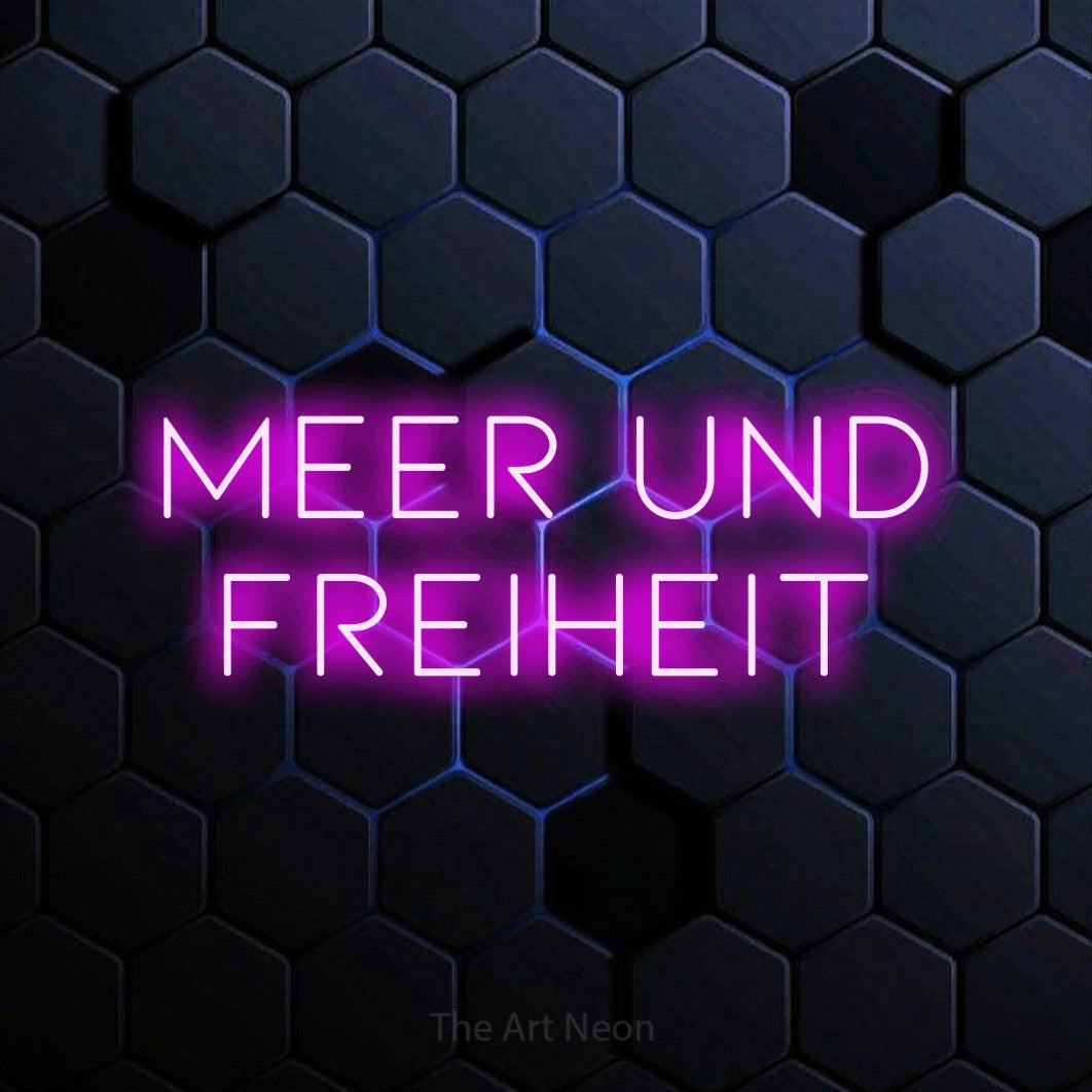 LED neon sign reading “Meer und Freiheit”, arranged in 2 lines.