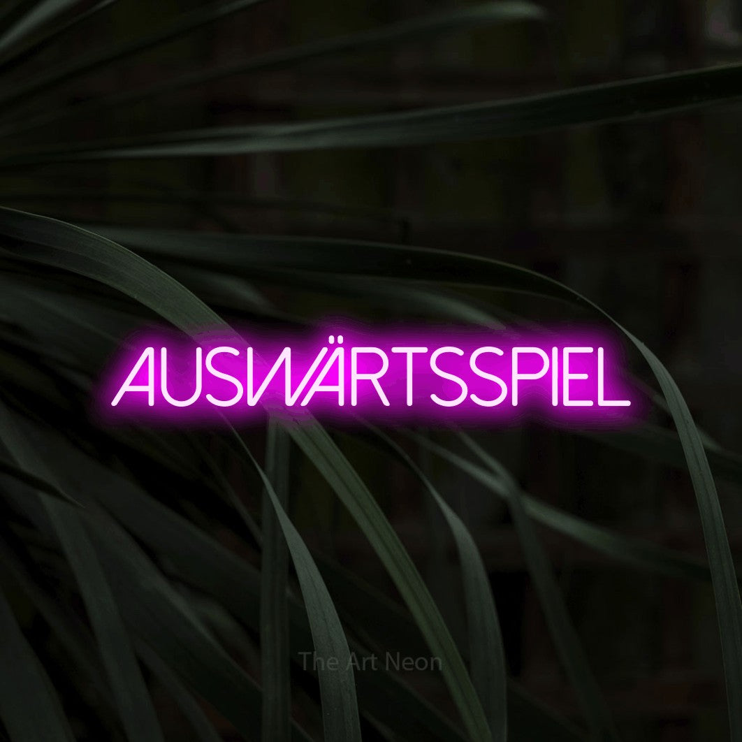 LED neon sign reading “AUSWÄRTSSPIEL”, arranged in a single line.