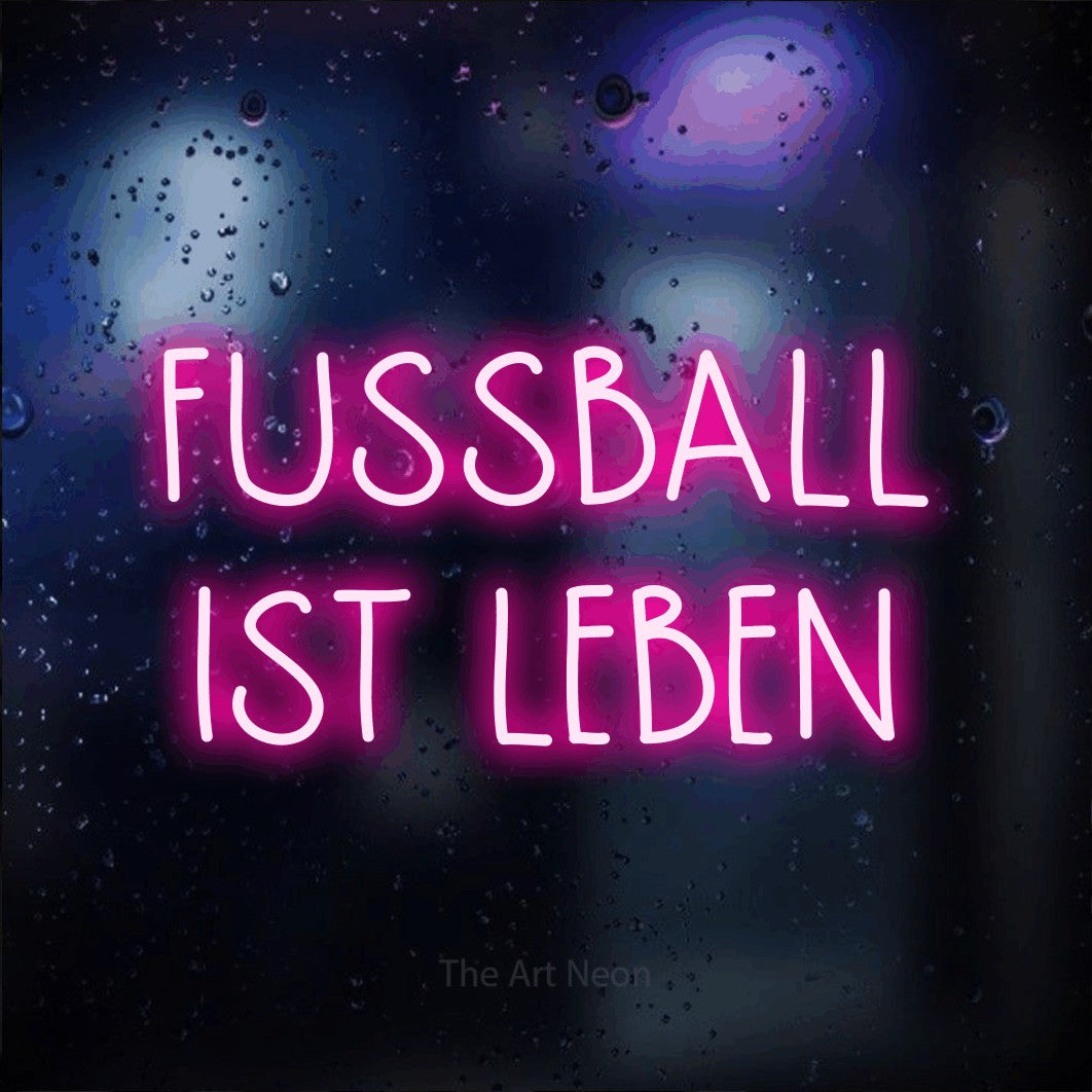 LED neon sign reading “FUSSBALL IST LEBEN”, arranged in 2 lines.