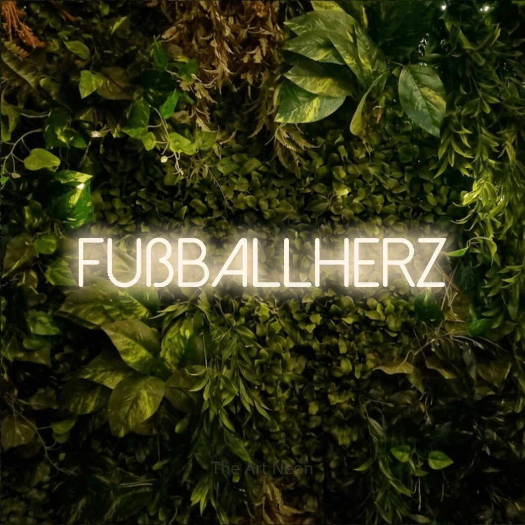 LED neon sign reading “Fußballherz”, arranged in a single line.