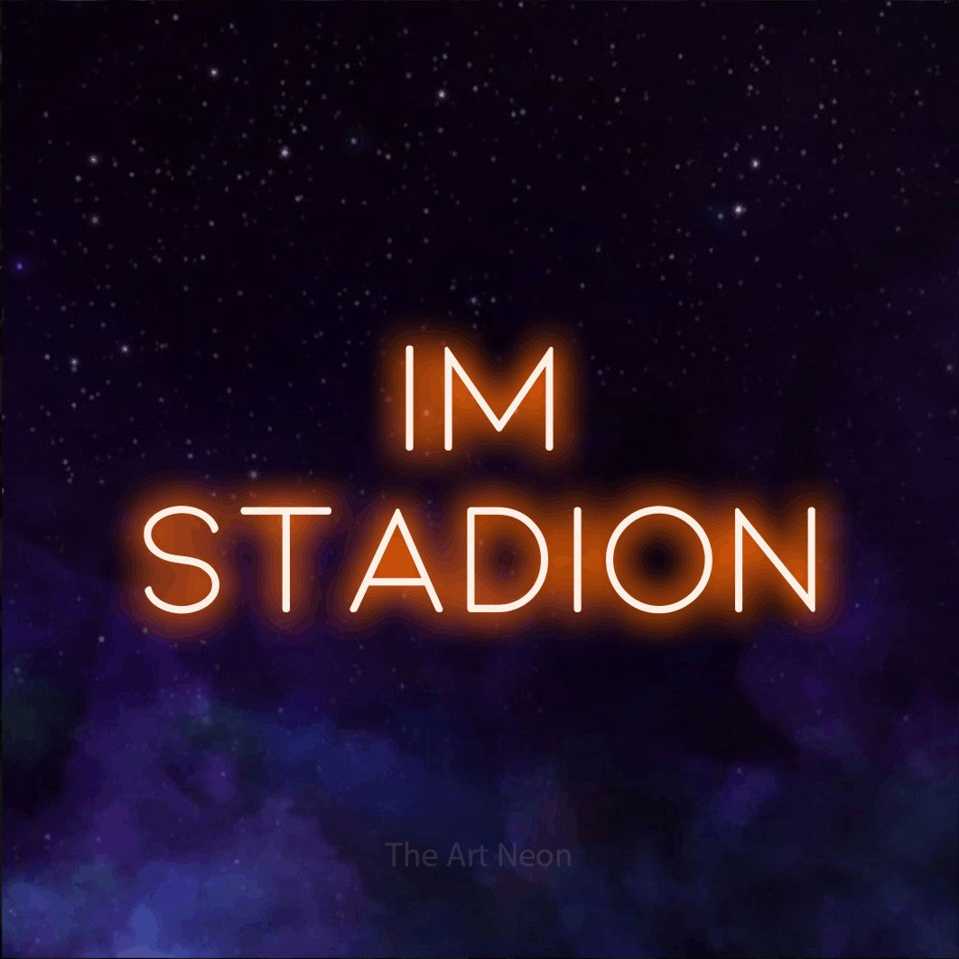LED neon sign reading “IM STADION”, arranged in 2 lines.