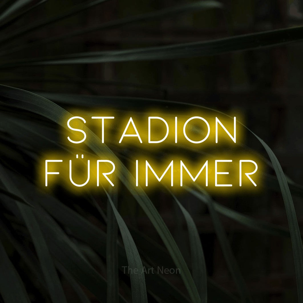 LED neon sign reading “stadion für immer”, arranged in 2 lines.