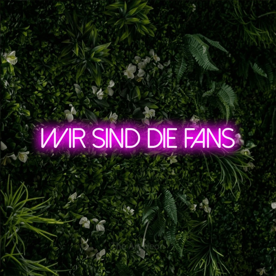 LED neon sign reading “Wir sind die Fans”, arranged in a single line.