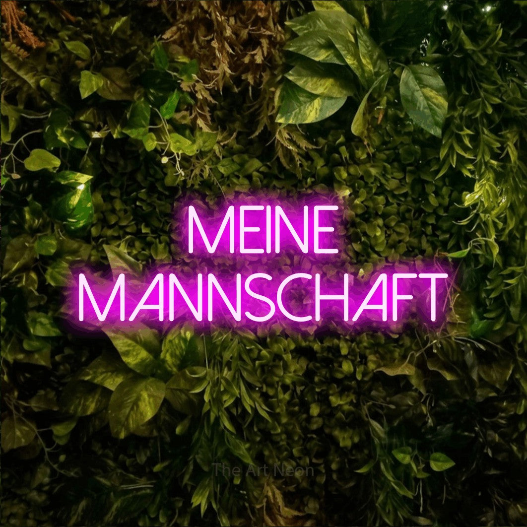 LED neon sign reading “meine MANNSCHAFT”, arranged in 2 lines.