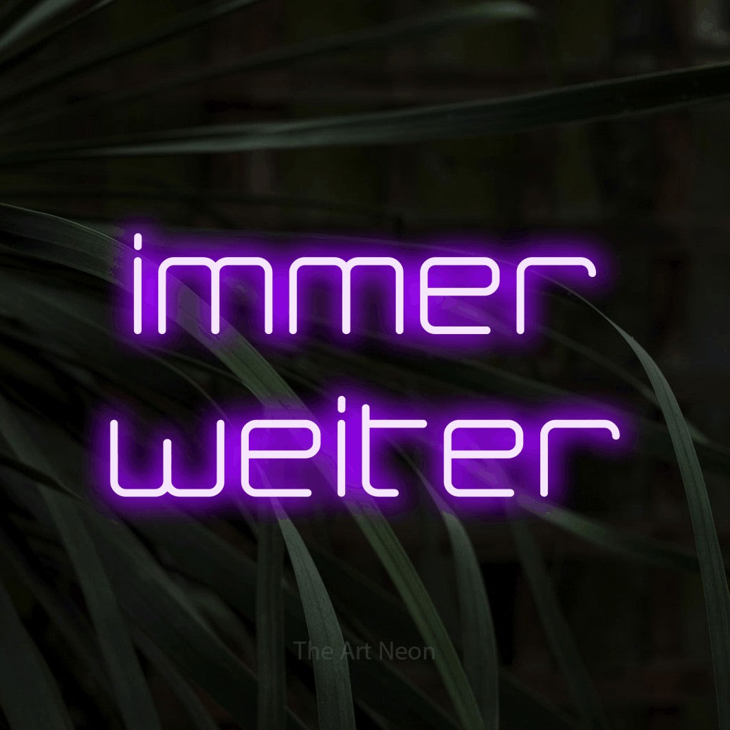 LED neon sign reading “immer weiter”, arranged in 2 lines.