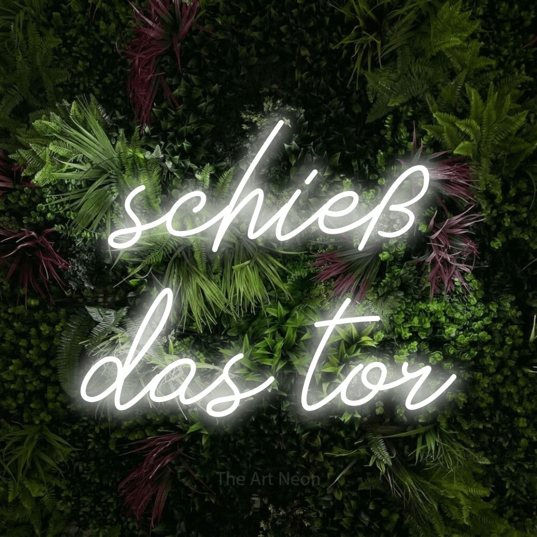 LED neon sign reading “schieß das tor”, arranged in 2 lines.