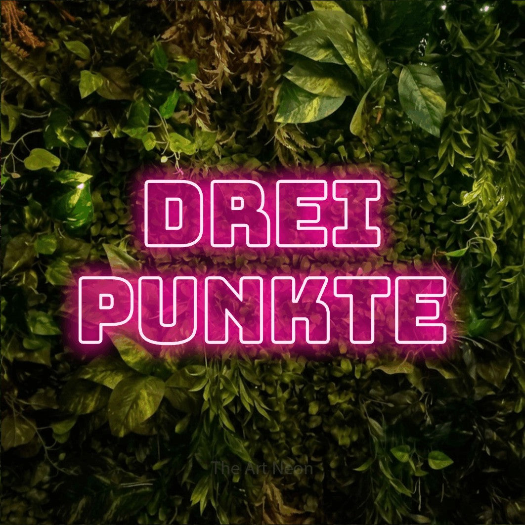 LED neon sign reading “Drei Punkte”, arranged in 2 lines.