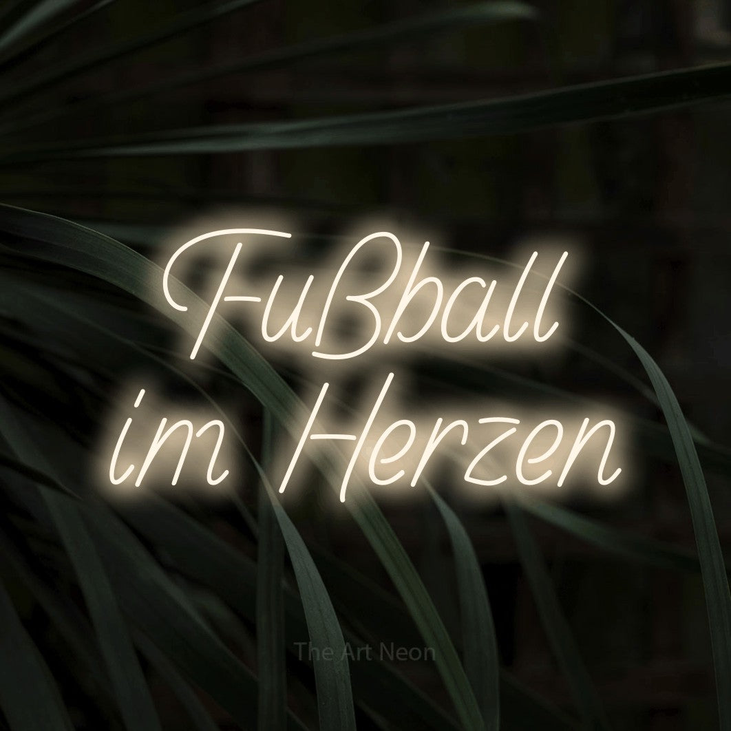 LED neon sign reading “Fußball im Herzen”, arranged in 2 lines.
