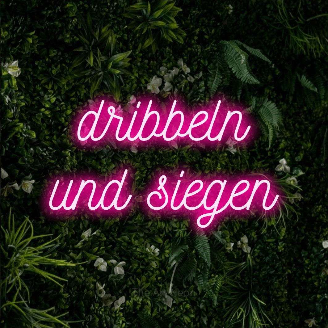 LED neon sign reading “dribbeln und siegen”, arranged in 2 lines.