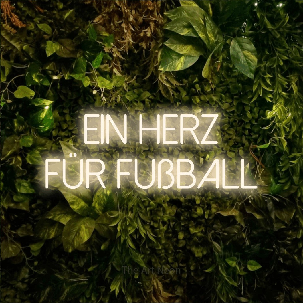 LED neon sign reading “ein herz für fußball”, arranged in 2 lines.