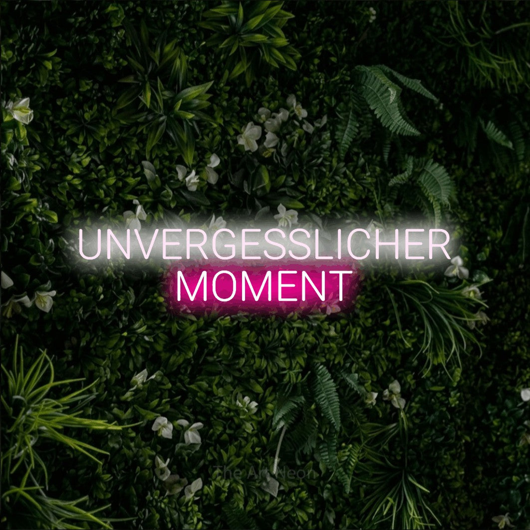 LED neon sign reading “UNVERGESSLICHER MOMENT”, arranged in 2 lines.