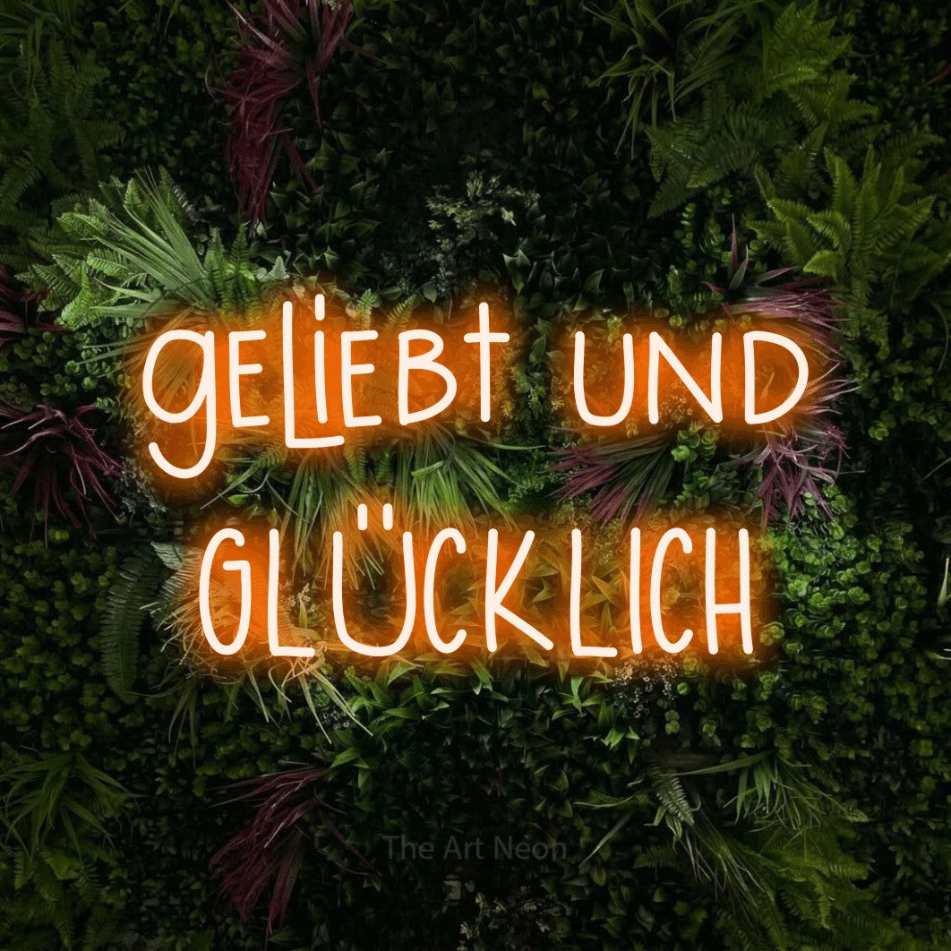 LED neon sign reading “geliebt und GLÜCKLICH”, arranged in 2 lines.