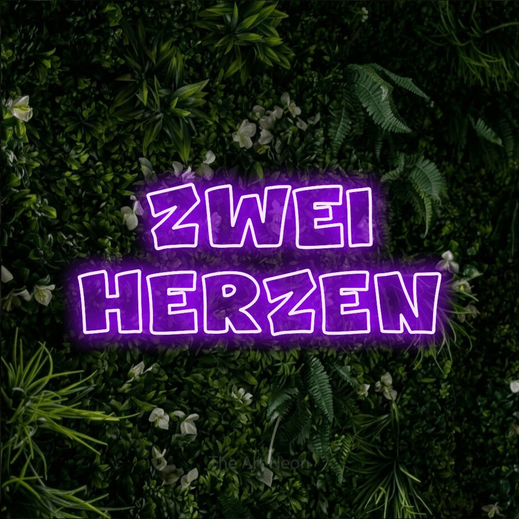LED neon sign reading “Zwei Herzen”, arranged in 2 lines.