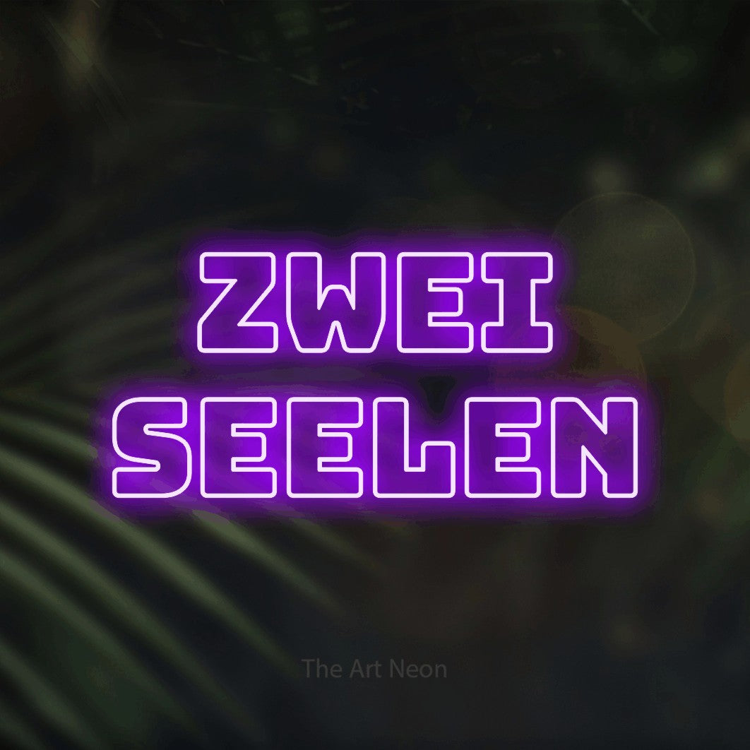 LED neon sign reading “zwei seelen”, arranged in 2 lines.