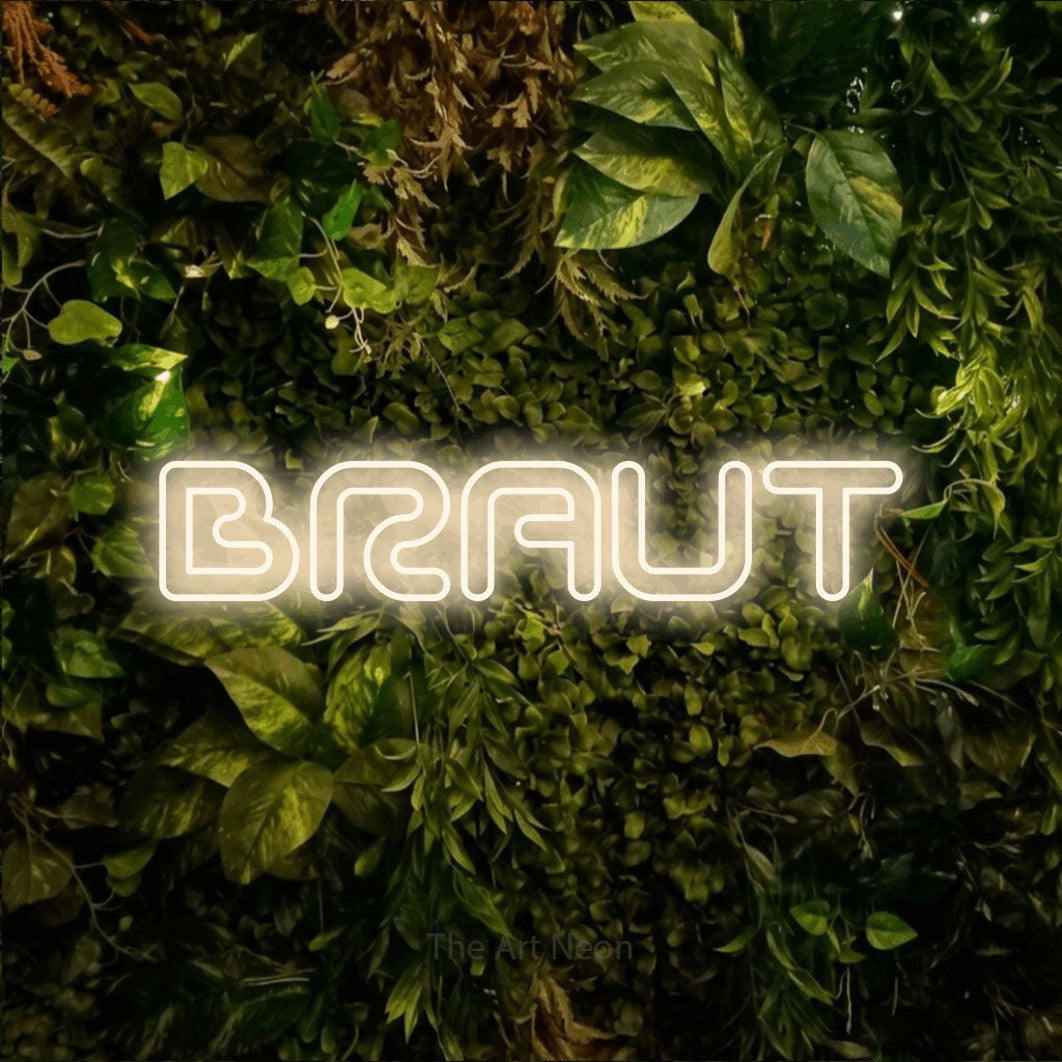 LED neon sign reading “BRAUT”, arranged in a single line.