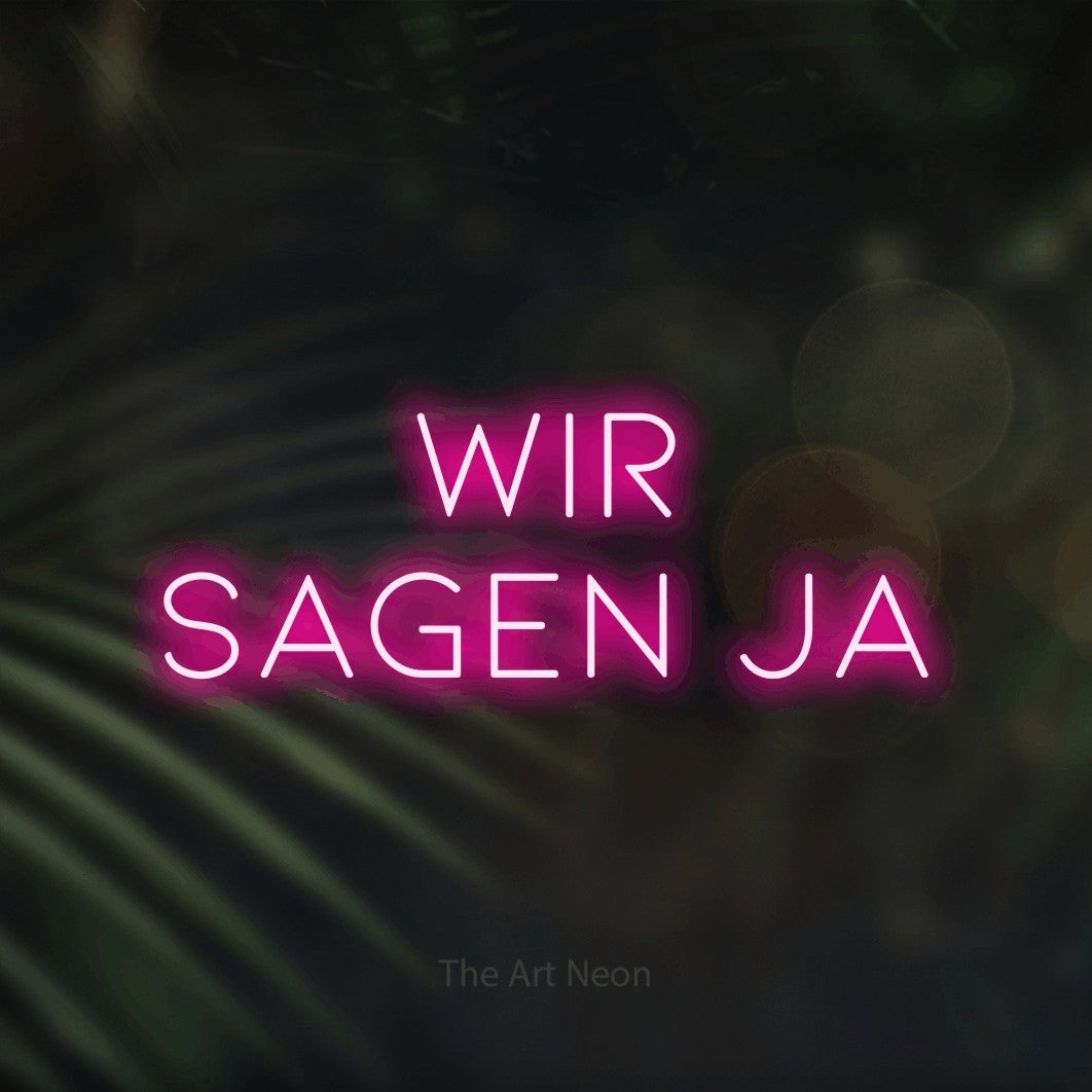 LED neon sign reading “WIR SAGEN JA”, arranged in 2 lines.