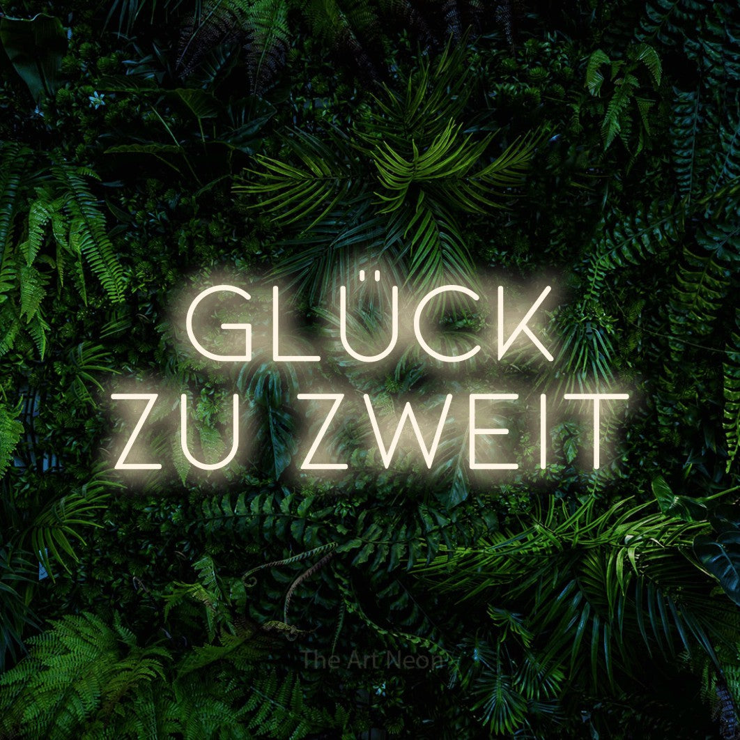 LED neon sign reading “GLÜCK zu zweit”, arranged in 2 lines.