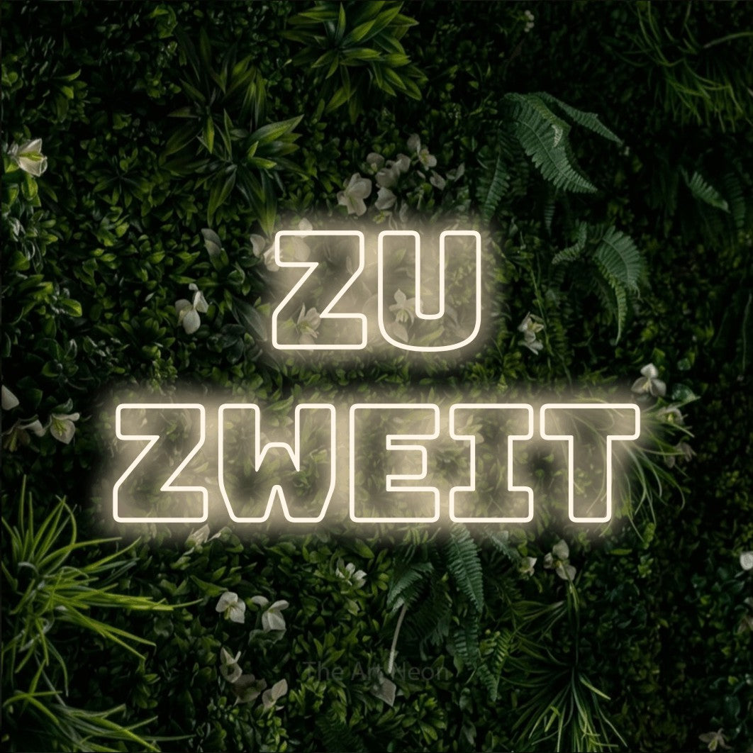 LED neon sign reading “ZU ZWEIT”, arranged in 2 lines.