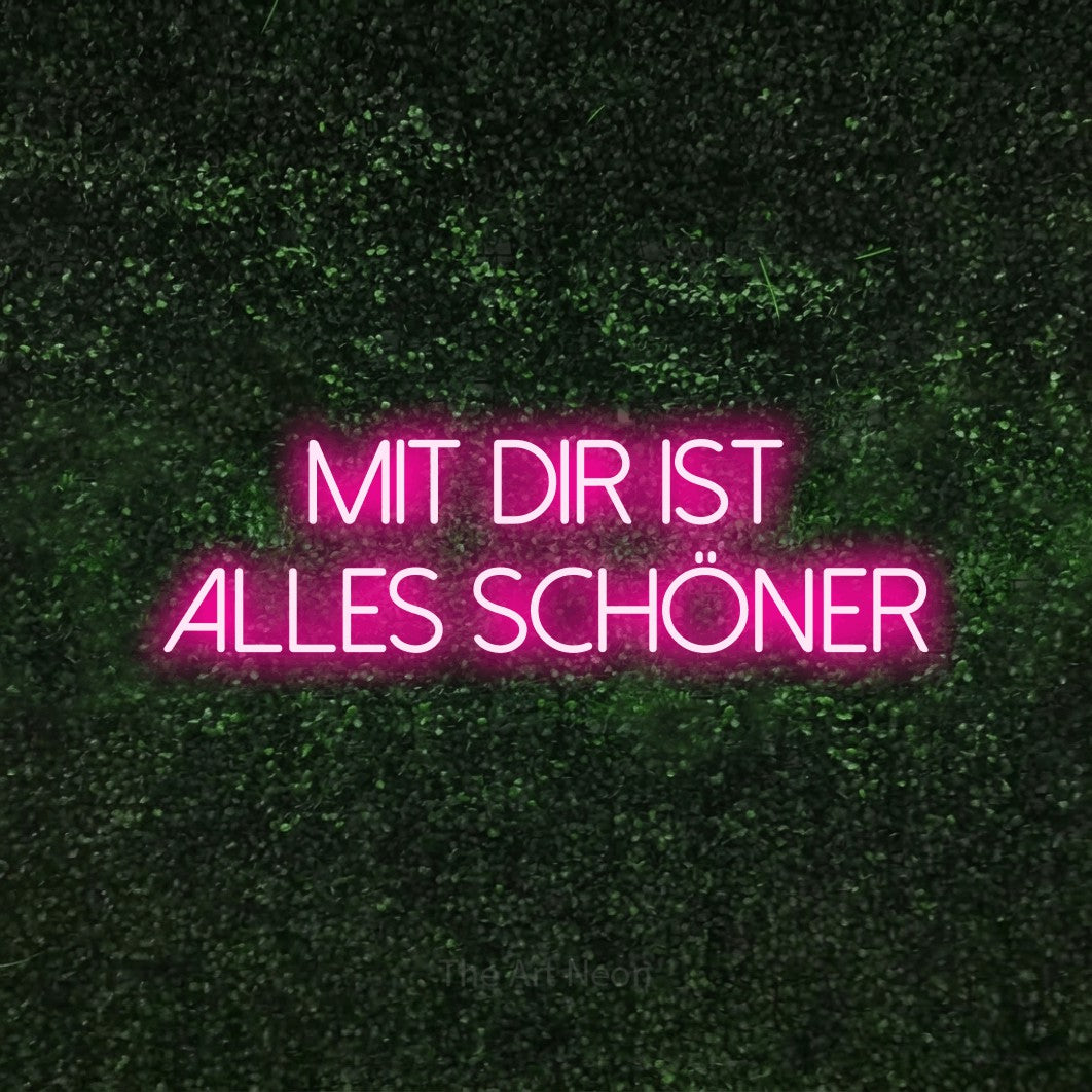 LED neon sign reading “Mit dir ist alles schöner”, arranged in 2 lines.