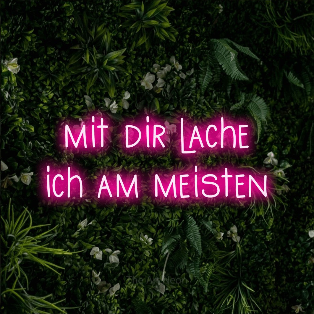LED neon sign reading “mit dir lache ich am meisten”, arranged in 2 lines.