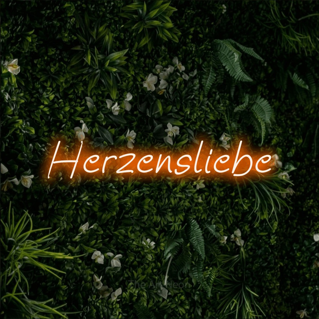 LED neon sign reading “Herzensliebe”, arranged in a single line.