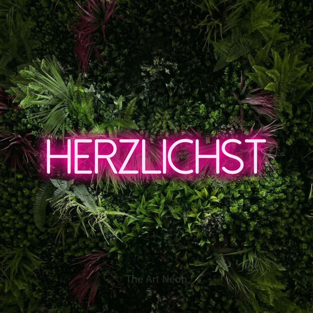 LED neon sign reading “herzlichst”, arranged in a single line.