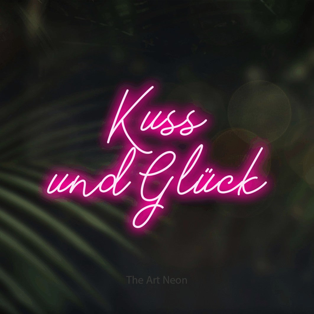 LED neon sign reading “Kuss und Glück”, arranged in 2 lines.