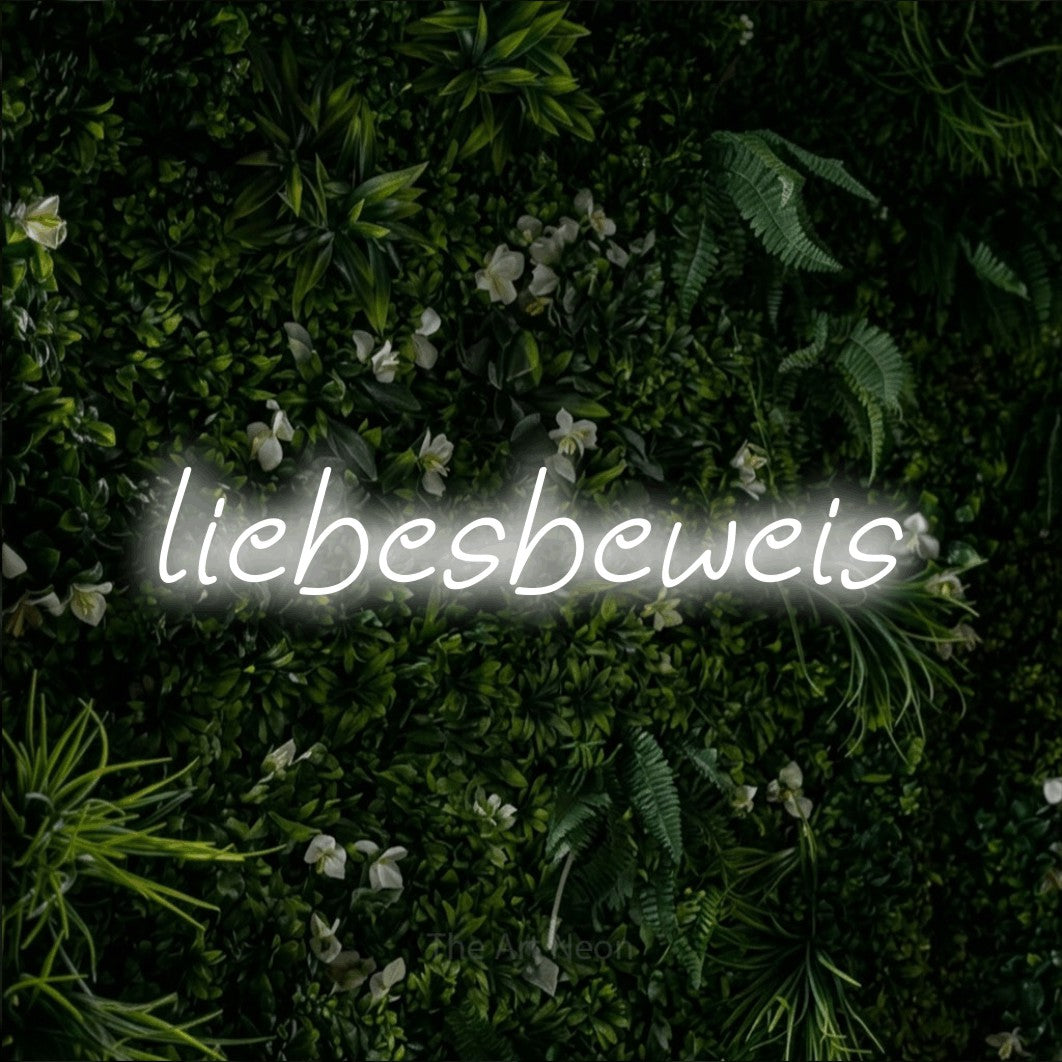 LED neon sign reading “liebesbeweis”, arranged in a single line.