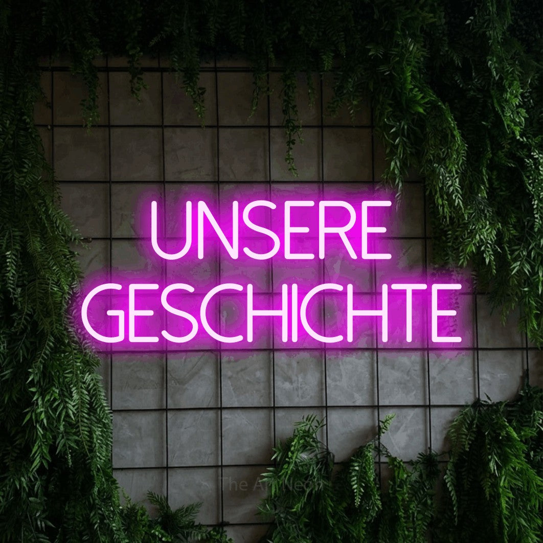 LED neon sign reading “UNSERE GESCHICHTE”, arranged in 2 lines.