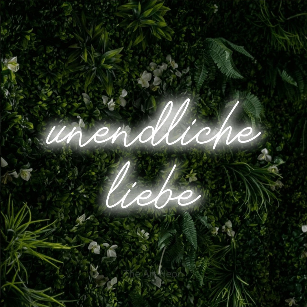 LED neon sign reading “unendliche liebe”, arranged in 2 lines.
