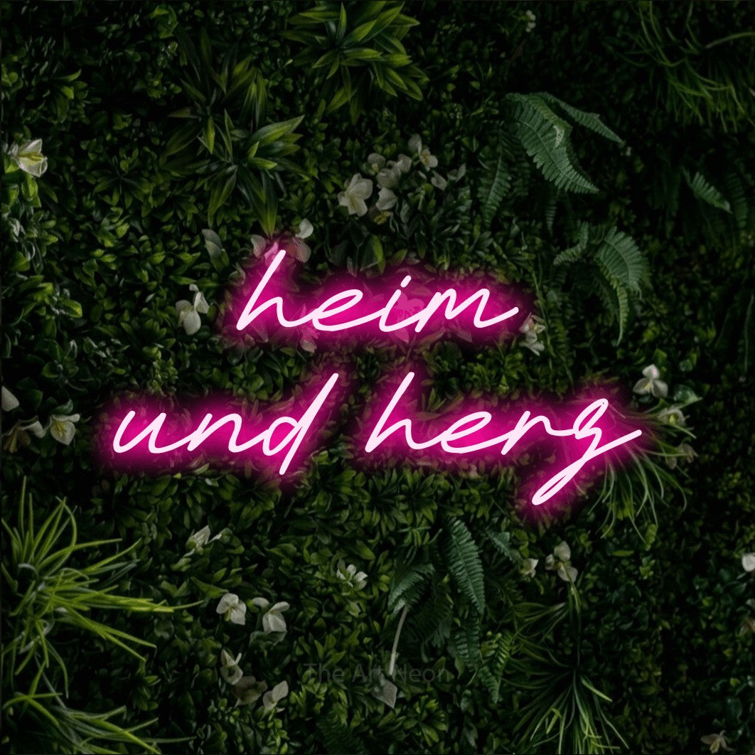 LED neon sign reading “heim und herz”, arranged in 2 lines.