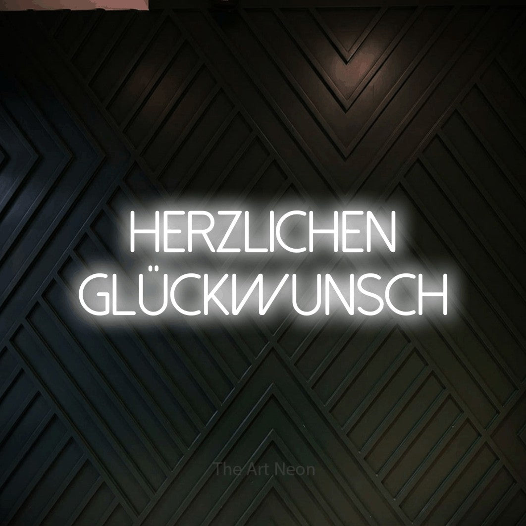 LED neon sign reading “HERZLICHEN GLÜCKWUNSCH”, arranged in 2 lines.