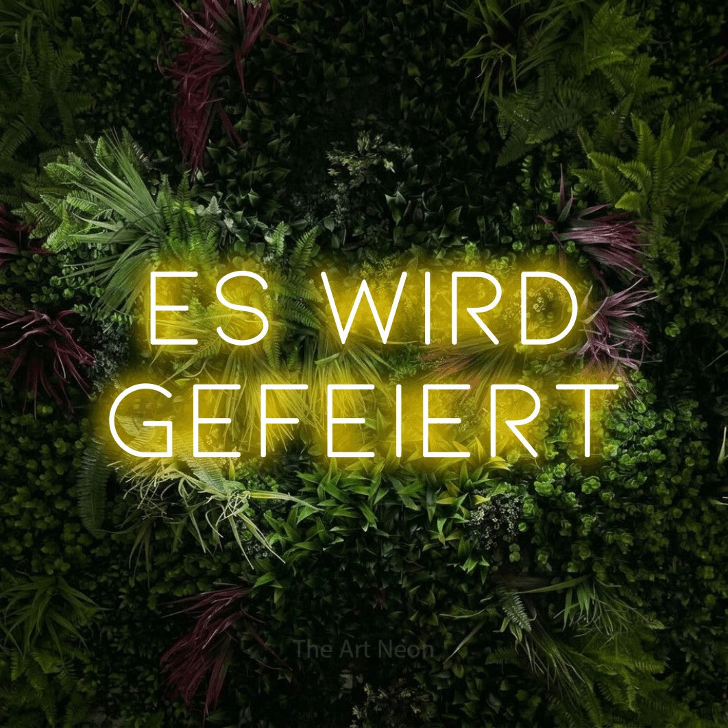 LED neon sign reading “Es wird gefeiert”, arranged in 2 lines.