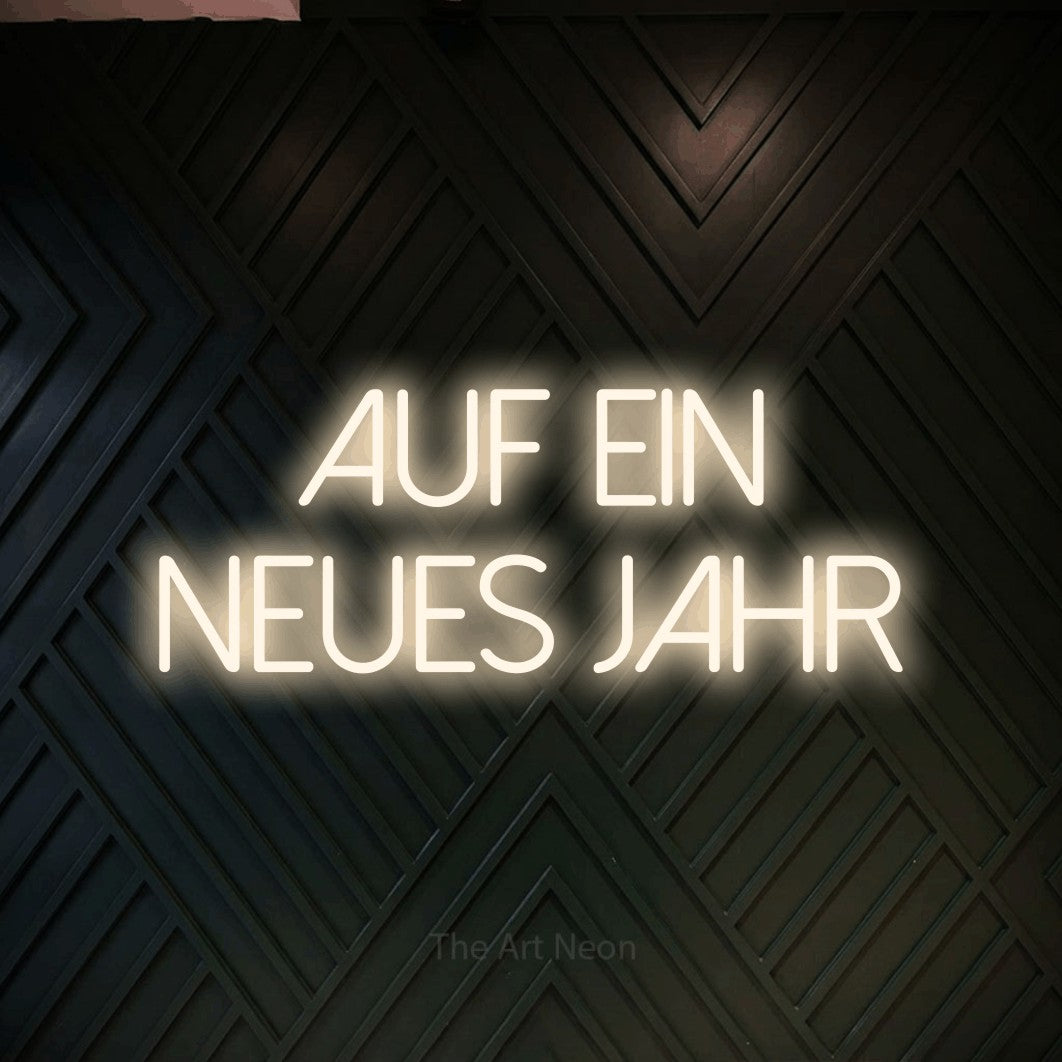 LED neon sign reading “Auf ein neues Jahr”, arranged in 2 lines.