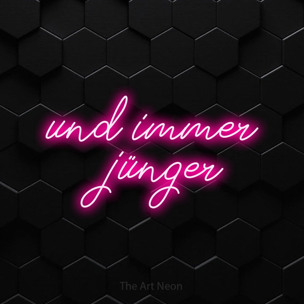 LED neon sign reading “und immer jünger”, arranged in 2 lines.