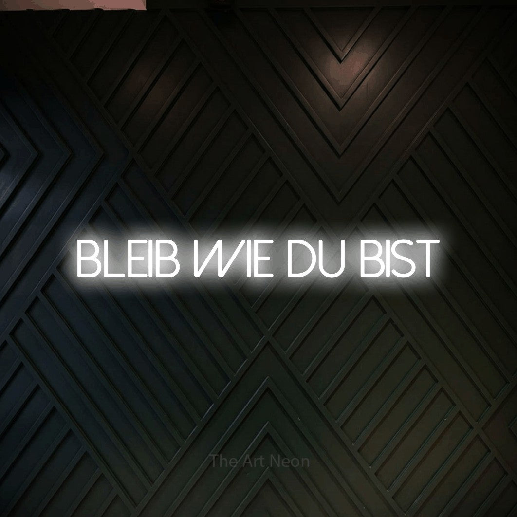 LED neon sign reading “BLEIB WIE DU BIST”, arranged in a single line.