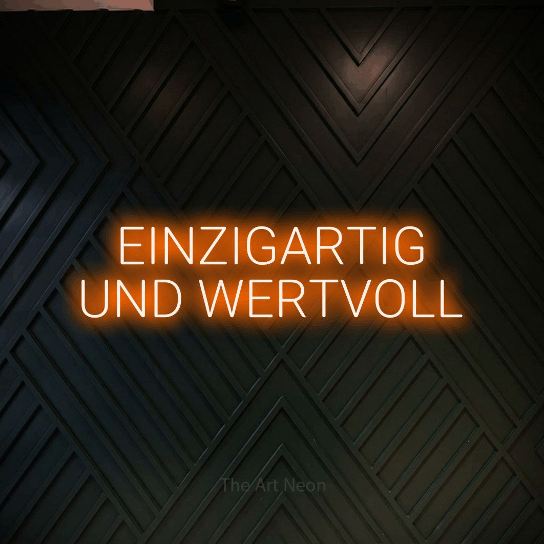 LED neon sign reading “EINZIGARTIG UND WERTVOLL”, arranged in 2 lines.