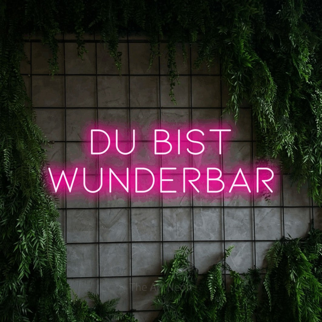 LED neon sign reading “DU BIST WUNDERBAR”, arranged in 2 lines.