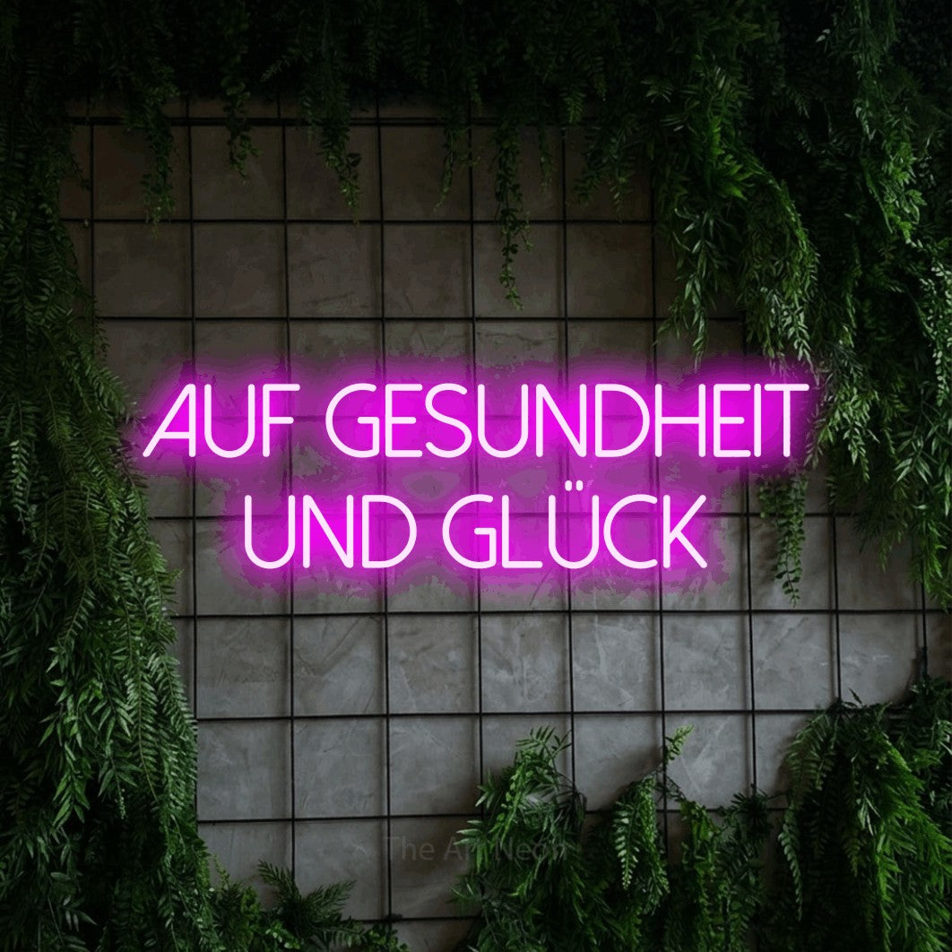 LED neon sign reading “auf gesundheit und glück”, arranged in 2 lines.