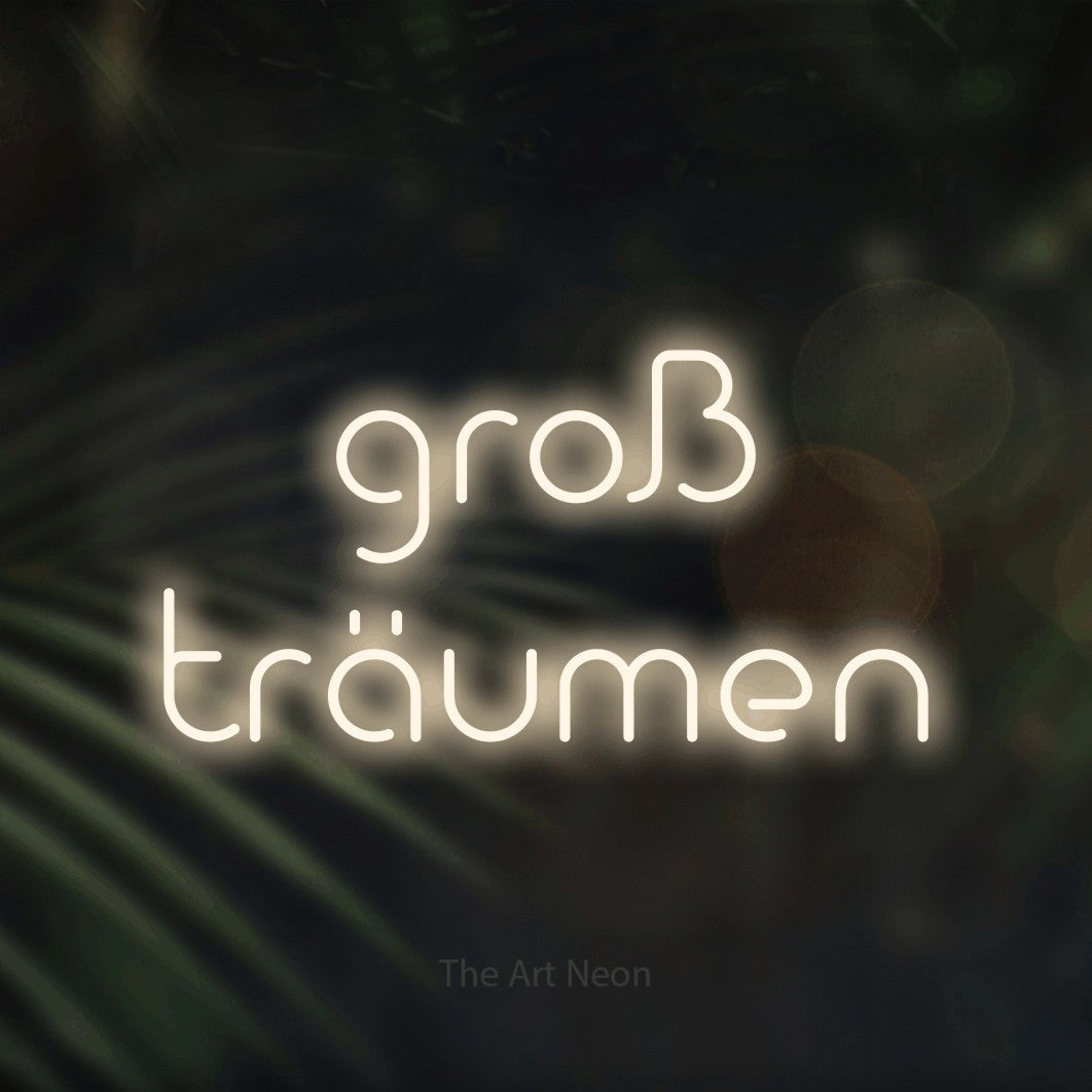 LED neon sign reading “groß träumen”, arranged in 2 lines.