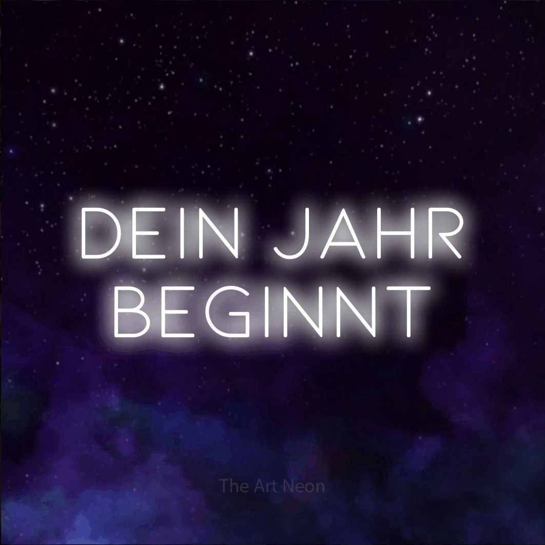 LED neon sign reading “DEIN JAHR BEGINNT”, arranged in 2 lines.