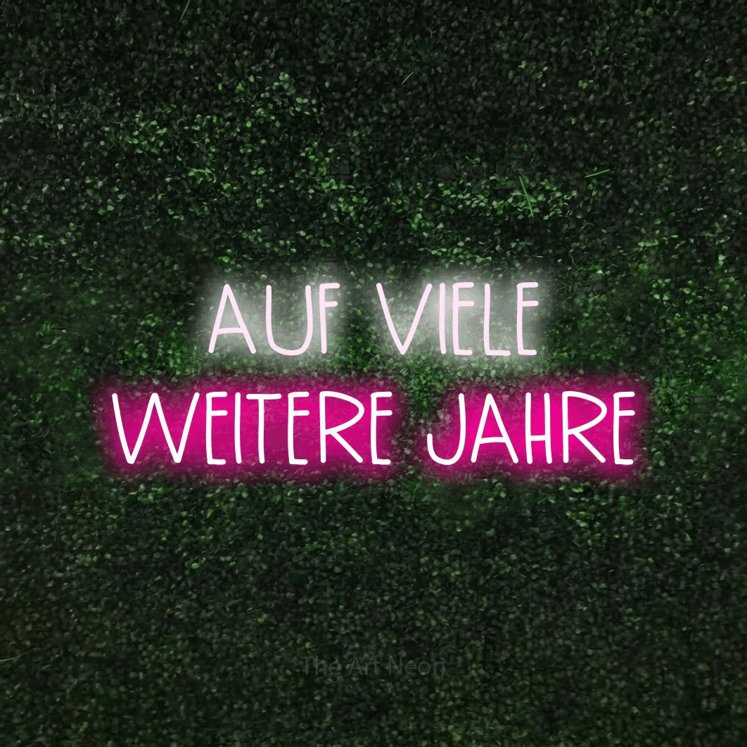 LED neon sign reading “AUF VIELE WEITERE JAHRE”, arranged in 2 lines.