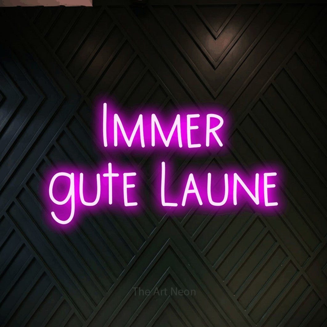 LED neon sign reading “Immer gute Laune”, arranged in 2 lines.