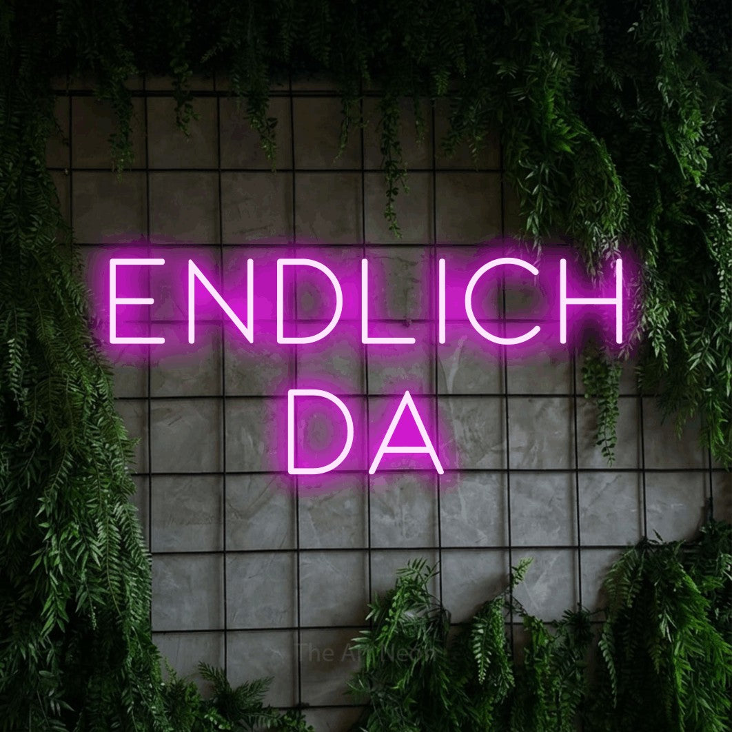 LED neon sign reading “ENDLICH DA”, arranged in 2 lines.