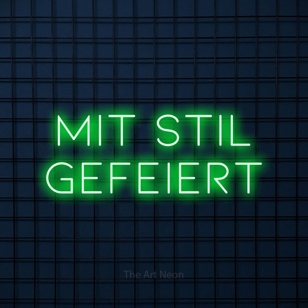 LED neon sign reading “Mit Stil gefeiert”, arranged in 2 lines.