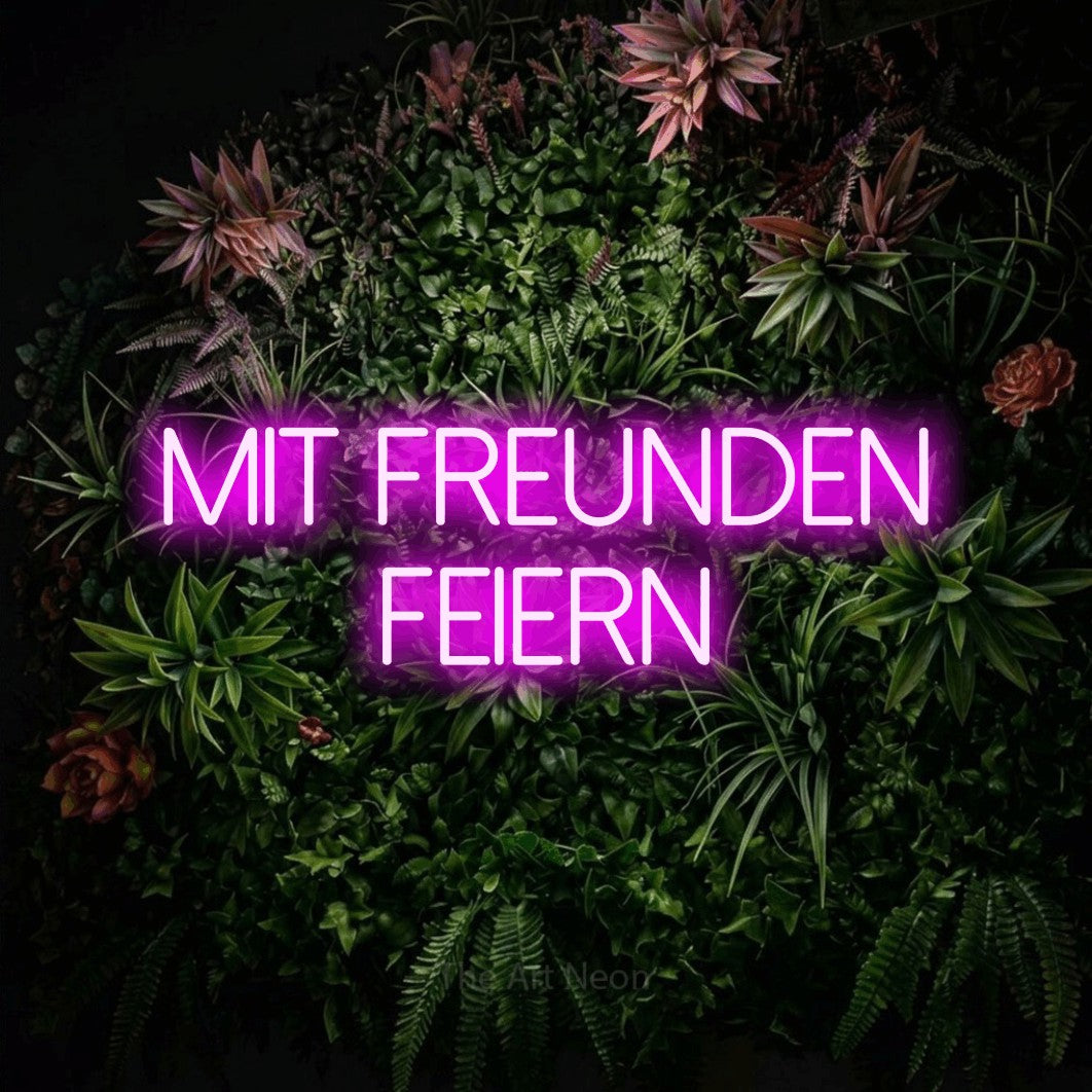 LED neon sign reading “mit freunden feiern”, arranged in 2 lines.