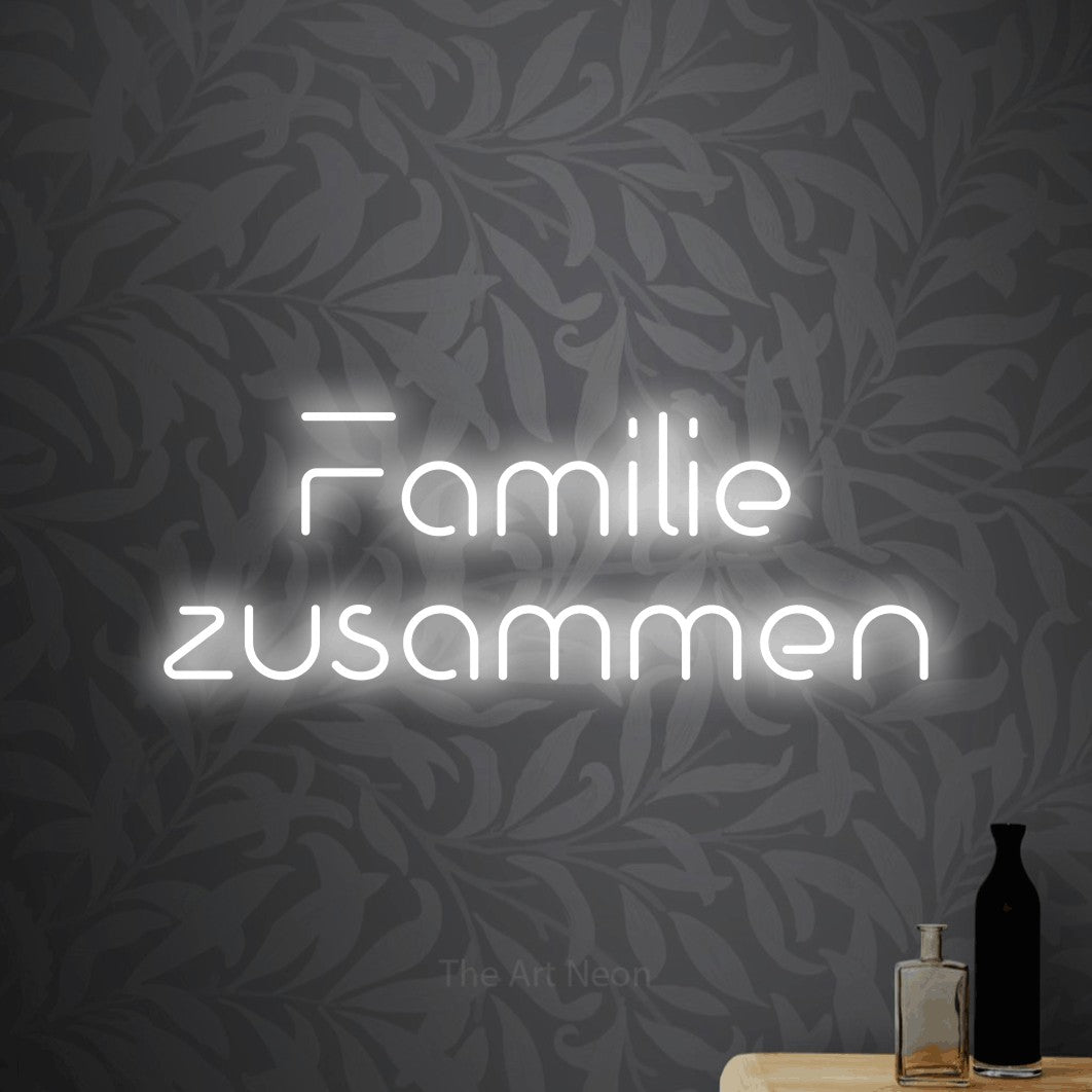 LED neon sign reading “Familie zusammen”, arranged in 2 lines.