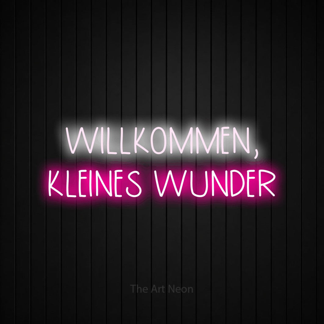 LED neon sign reading “WILLKOMMEN, KLEINES WUNDER”, arranged in 2 lines.